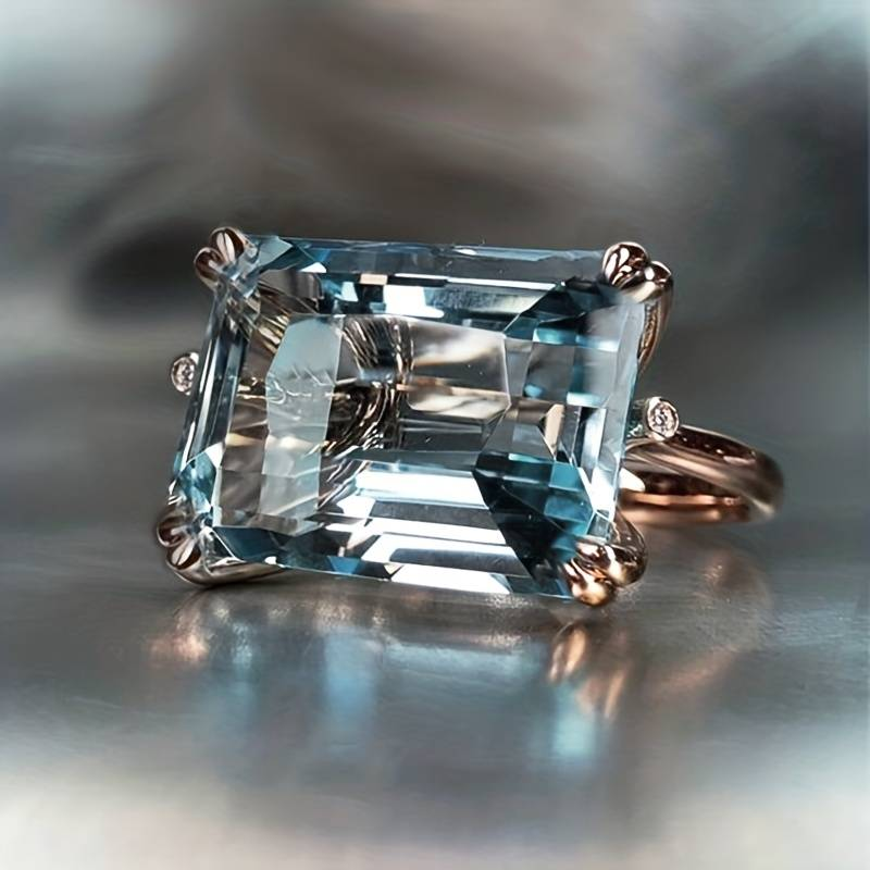 Surface Glacée | Bague en or rose avec grande pierre bleu clair – Vue 01