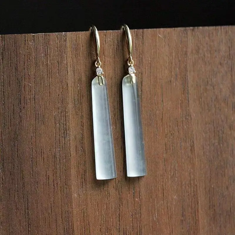 Ligne Barre | Boucles d'oreilles dorées avec longue barre blanche – Vue 01