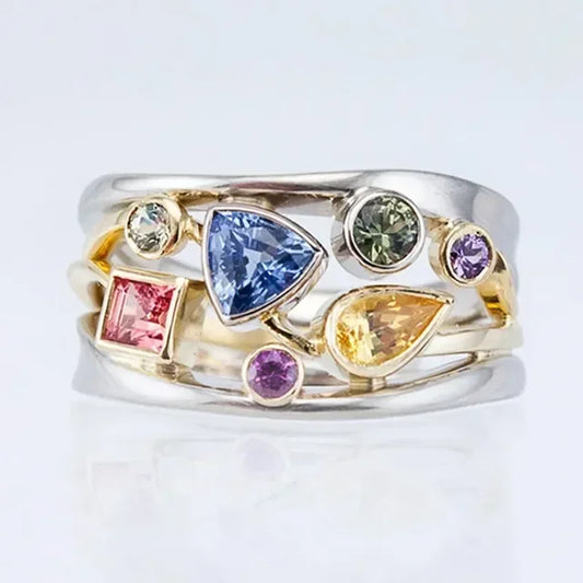 Bague argentée avec pierres colorées bleues, vertes, jaunes et roses