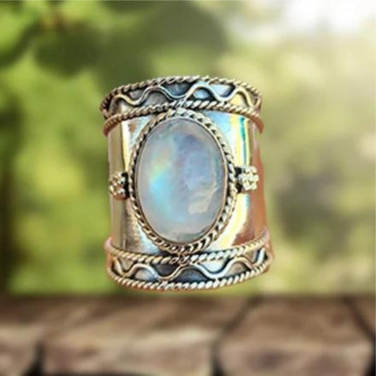 Surface Irisée | Bague large argentée avec grande pierre chatoyante – Vue 01