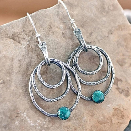 Anneau Spirale | Boucles d'oreilles argentées avec cercles et pierre turquoise – Vue 01