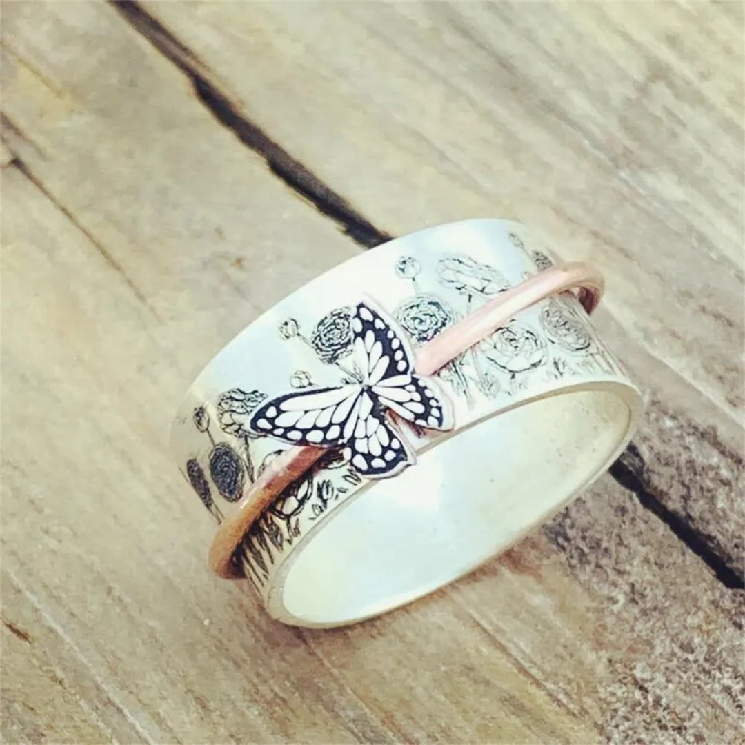Aile Tournante | Bague tournante large argentée à motif de papillon – Vue 01
