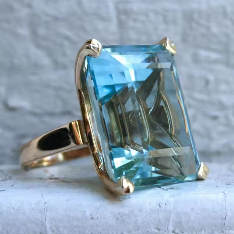 Lumière de Lagune | Bague dorée avec grande pierre bleu-vert – Vue 01