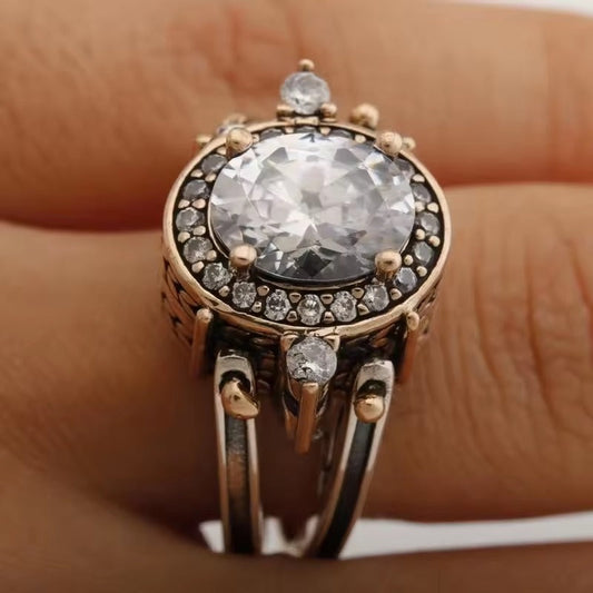 Éclat Ovale | Bague argentée et or rose avec pierre claire ovale – Vue 01