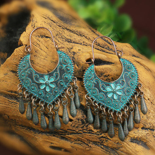 Éventail Patiné | Boucles d'oreilles à patine turquoise et franges – Vue 01