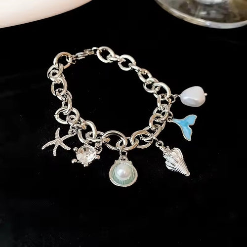 Fond Marin | Bracelet à breloques argenté aux motifs marins – Vue 01