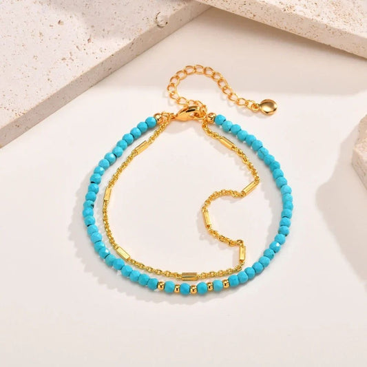 Double Chaîne | Bracelet double doré avec perles turquoise – Vue 01