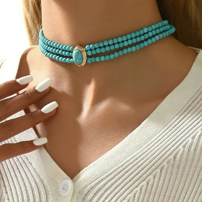 Théa | Collier à trois rangs avec perles turquoise – Vue 01