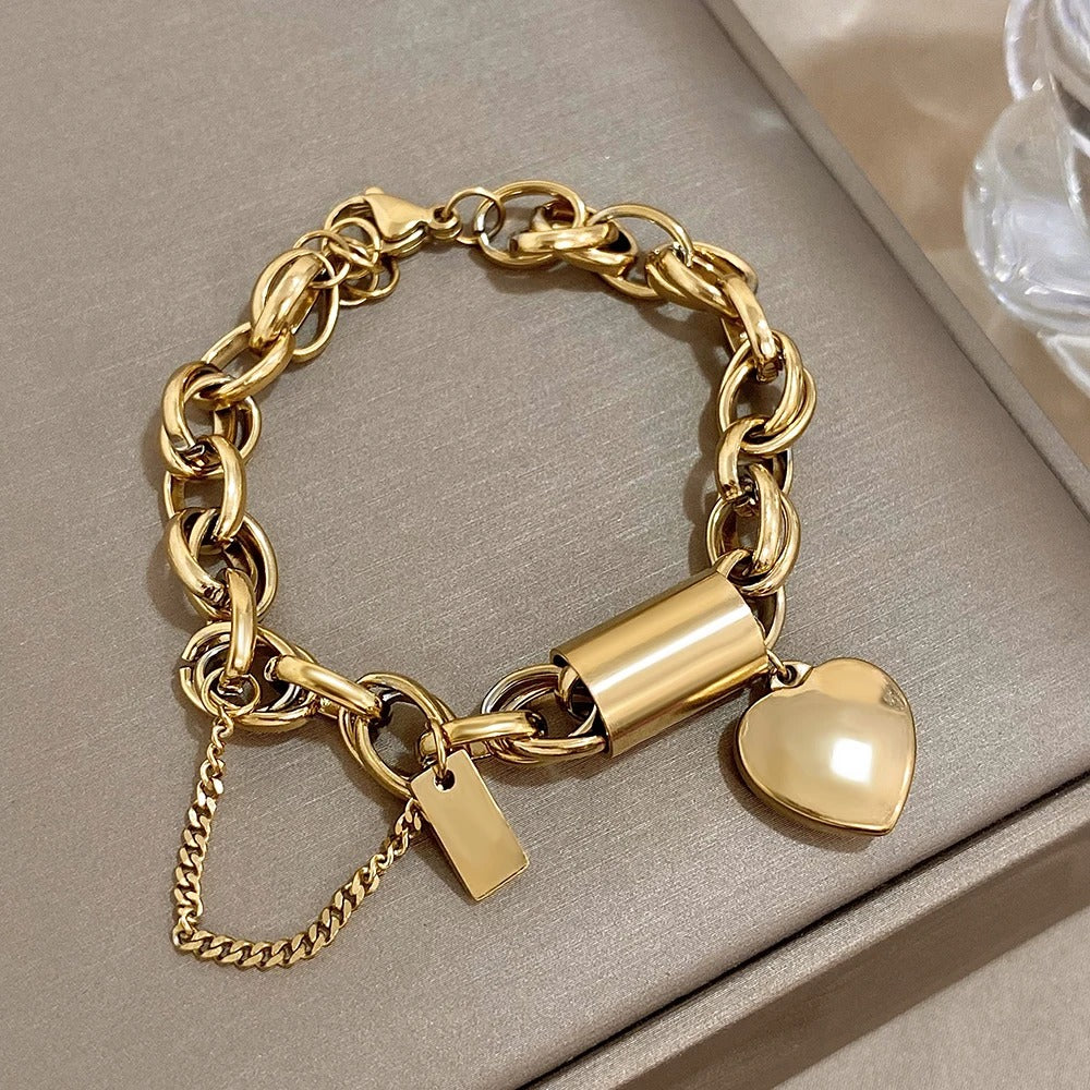 Cadenas Cœur | Bracelet chaîne épais avec pendentif cœur et chaînette de sécurité – Vue 01