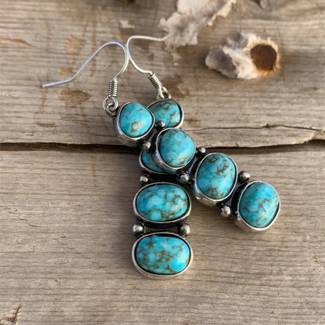 Cascade en Escalier | Boucles d'oreilles argentées avec quatre pierres turquoise – Vue 01