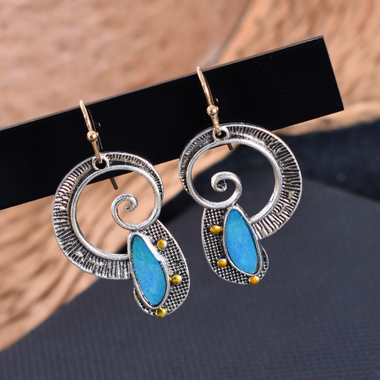 Onde Spirale | Boucles d'oreilles avec spirale et pierre bleue – Vue 01
