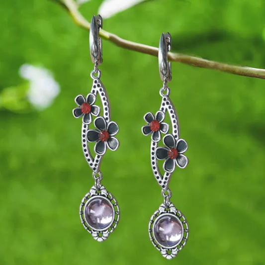 Ovale Fleuri | Longues boucles d'oreilles avec fleurs et pierre claire – Vue 01