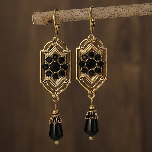 Éclat de Nuit | Boucles d'oreilles dorées avec pierres noires – Vue 01