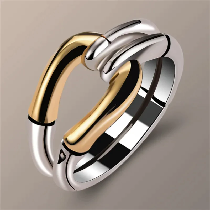 Ruban Noué | Bague dorée et argentée à motif de nœud – Vue 01