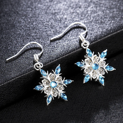 Étoile de Givre | Boucles d'oreilles étoile argentées avec pierre bleu clair – Vue 01