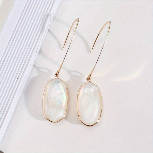 Ovale Blanc | Boucles d'oreilles dorées avec surface ovale blanche – Vue 01