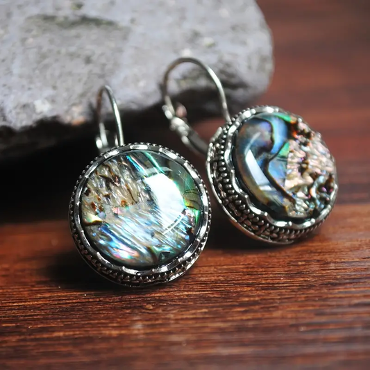 Disque Chatoyant | Boucles d'oreilles avec surface ronde changeante – Vue 01