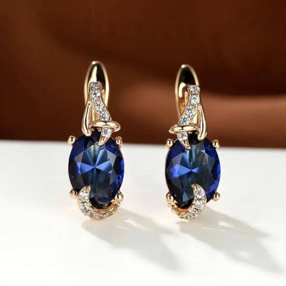 Bleu Minuit | Boucles d'oreilles dorées avec pierre bleu foncé – Vue 01