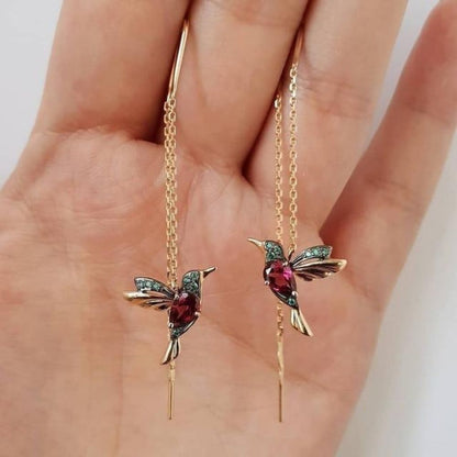 Battement d'Aile | Boucles d'oreilles dorées à motif d'oiseau – Vue 01