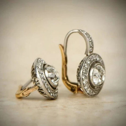 Disque Bicolore | Boucles d'oreilles argentées et dorées avec pierres claires – Vue 01