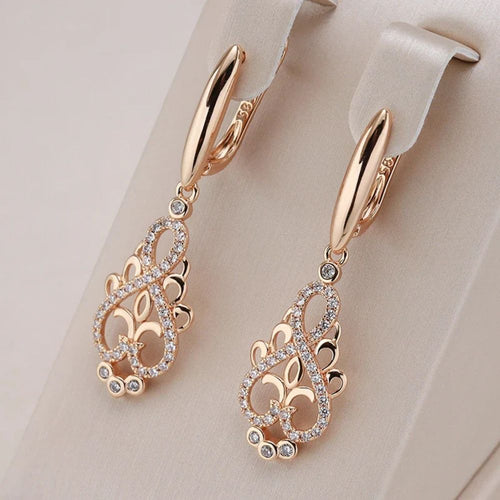 Rêve de Fée | Boucles d'oreilles dorées avec pierre turquoise – Vue 01
