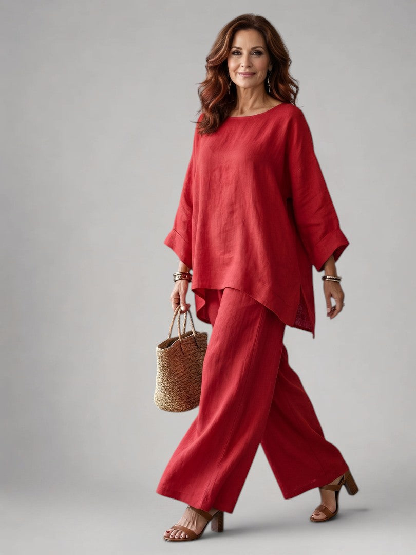 Femme portant un ensemble deux pièces avec tunique oversize et pantalon à jambes larges, coloris rouge
