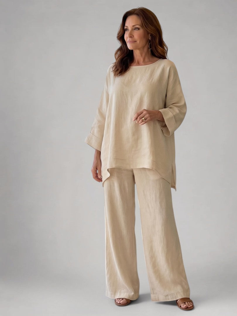 Femme portant un ensemble deux pièces avec tunique oversize et pantalon à jambes larges, coloris beige