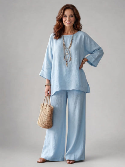 Femme portant un ensemble deux pièces avec tunique oversize et pantalon à jambes larges, coloris bleu