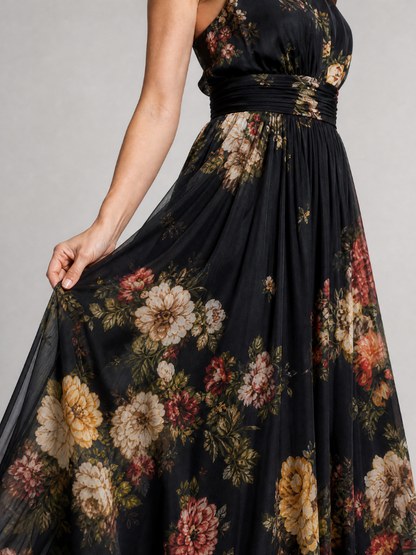 Agnès — Robe longue dos nu à fleurs sur fond noir