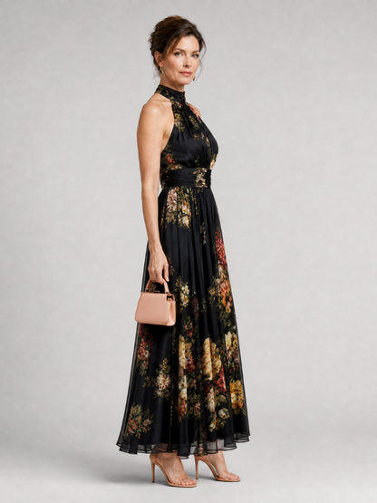 Agnès — Robe longue dos nu à fleurs sur fond noir